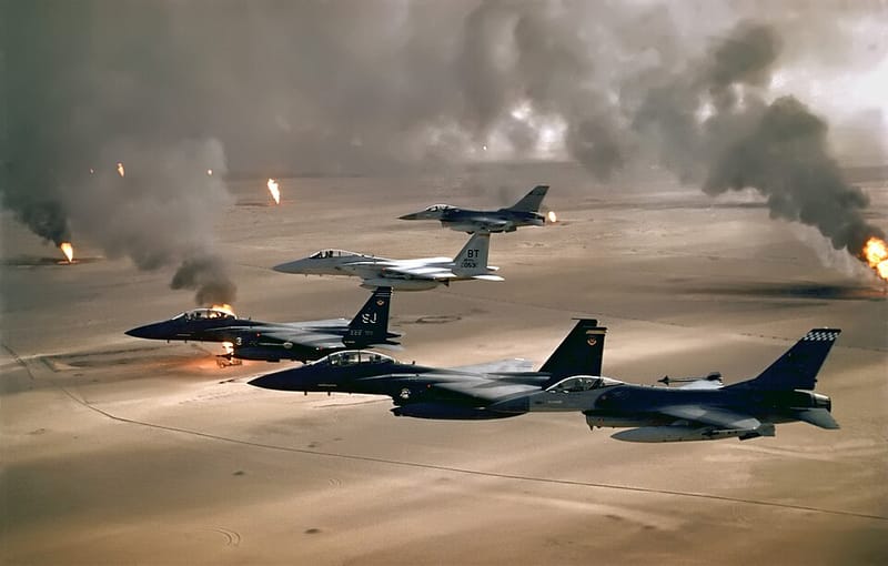 U.S. Air Force jets flying over burning Kuwaiti oil fields during Desert Storm