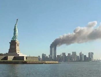 Smoke rising from the World Trade Center behind the Statue of Liberty