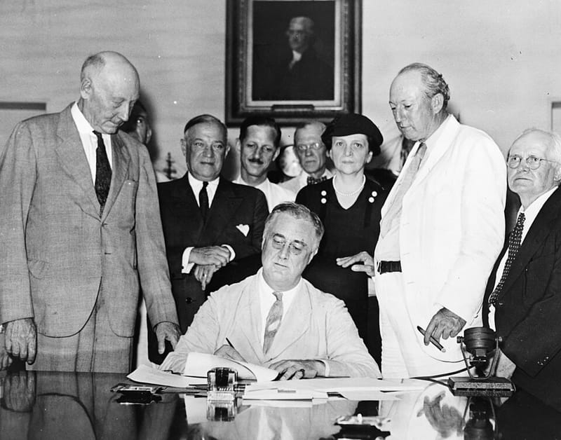 President Franklin D. Roosevelt signing the Social Security Act