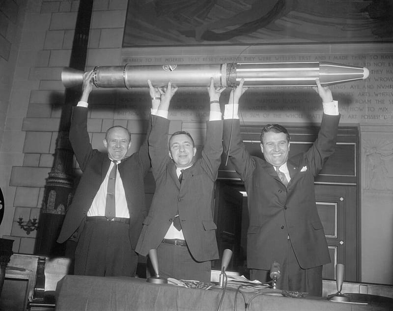 William Pickering, James Van Allen, and Wernher von Braun hold up a model of Explorer 1, America’s first satellite, in 1958